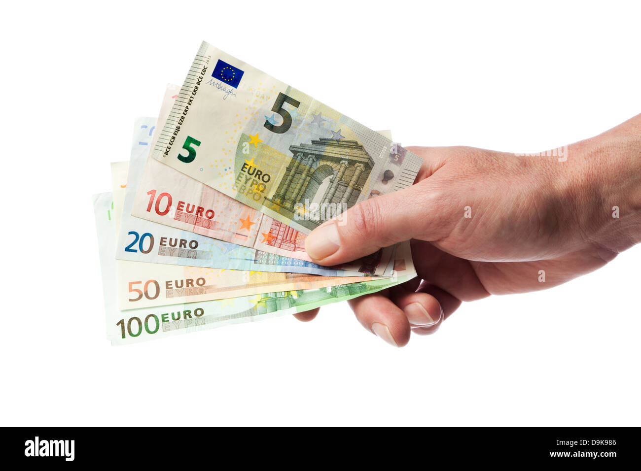 Hombre mano sosteniendo la moneda europea facturas desde 5 a 100 euros en abanico, aislado sobre fondo blanco. Foto de stock