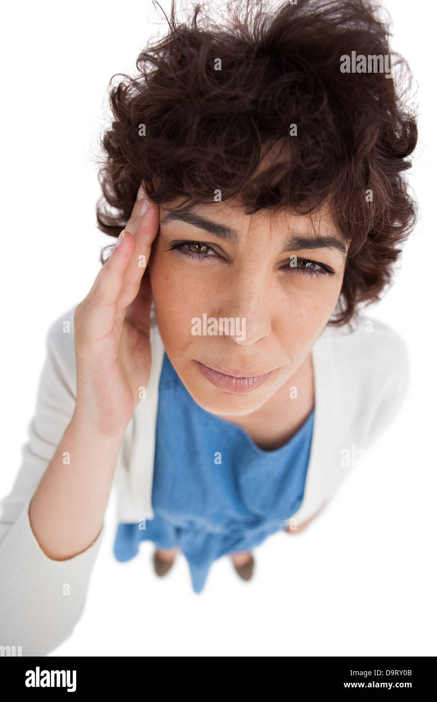Sobrecarga de mujer con un permanente dolor de cabeza Foto de stock