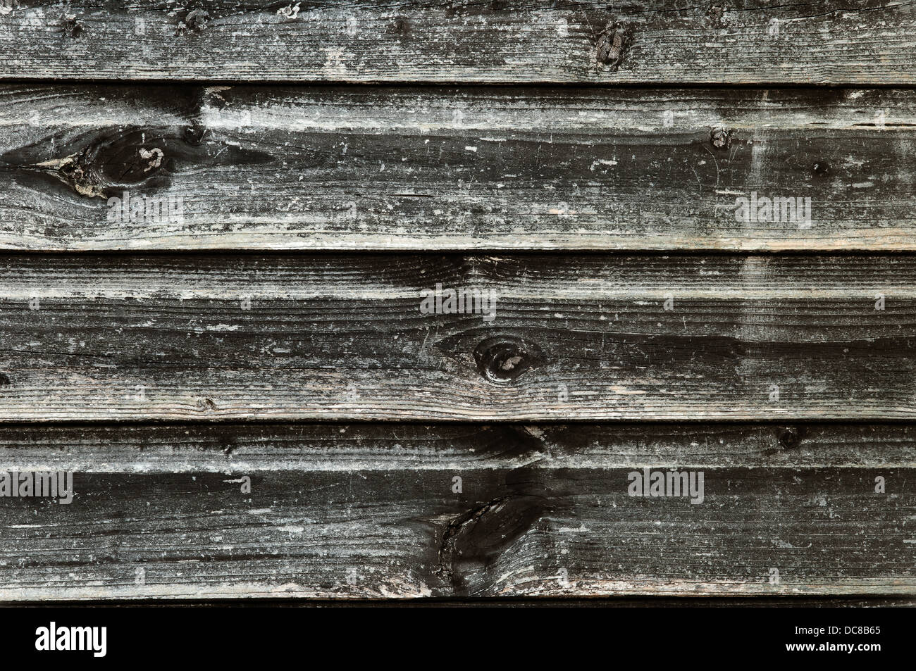 La textura de la madera, con aspecto erosionado, antiguo y oscuro - vintage Foto de stock