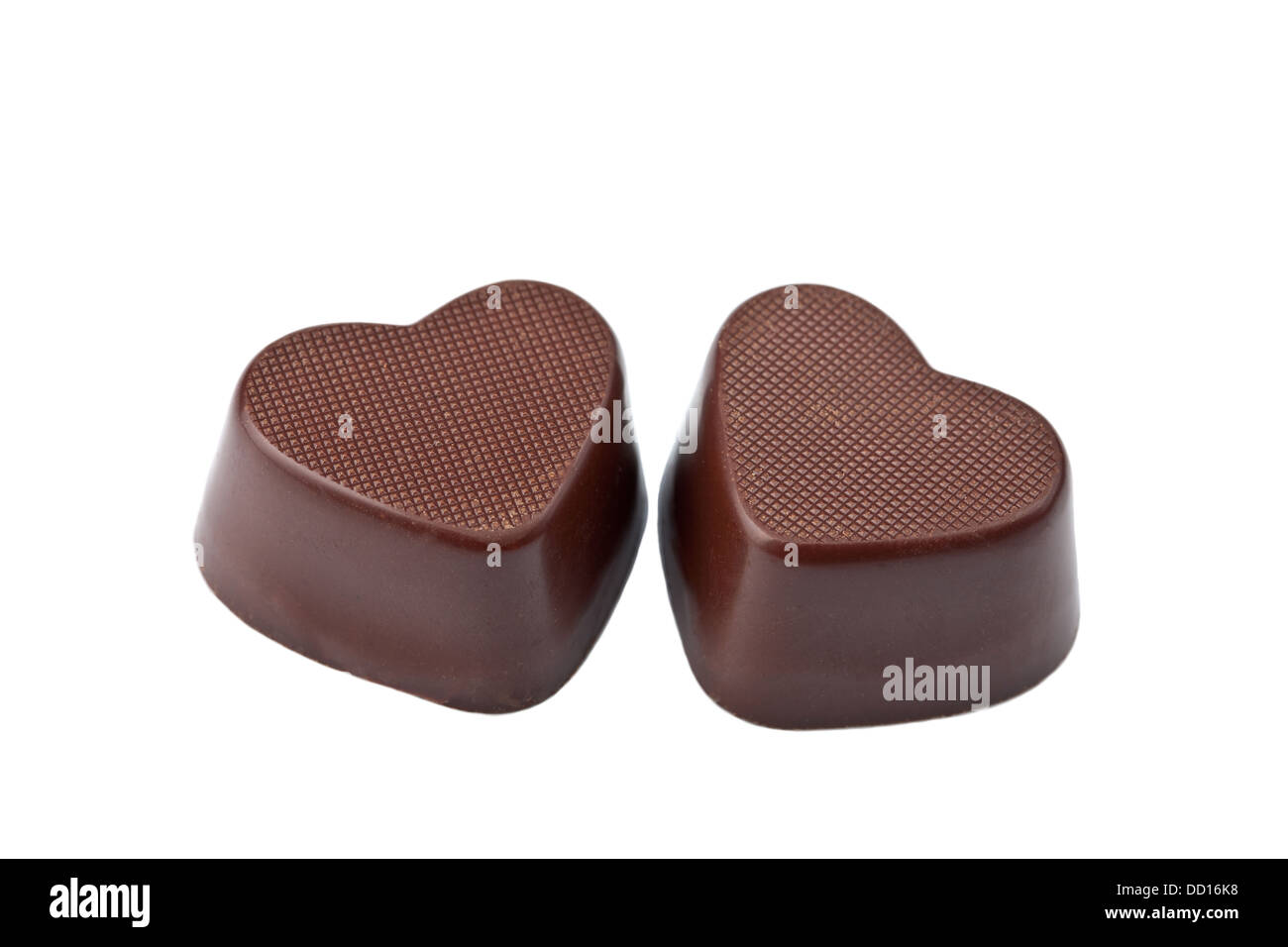 Los corazones de chocolate aislado Foto de stock