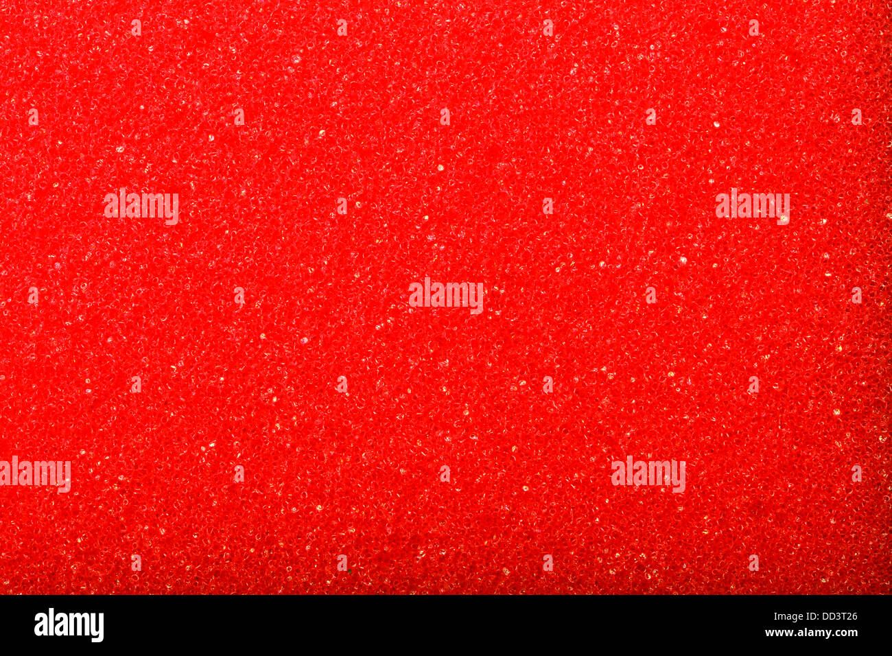 Esponja de espuma de celulosa textura roja - fondo. Foto de stock