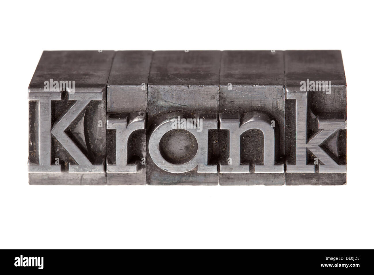 Antiguas letras de plomo que forman la palabra "Krank" alemán para enfermos Foto de stock