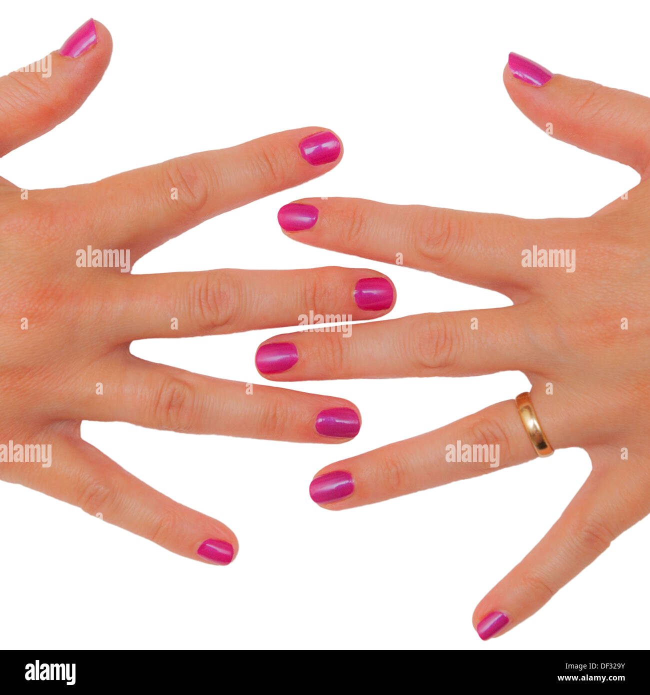 Un womans manos recién arreglados con las uñas pintadas de color rosa Foto de stock