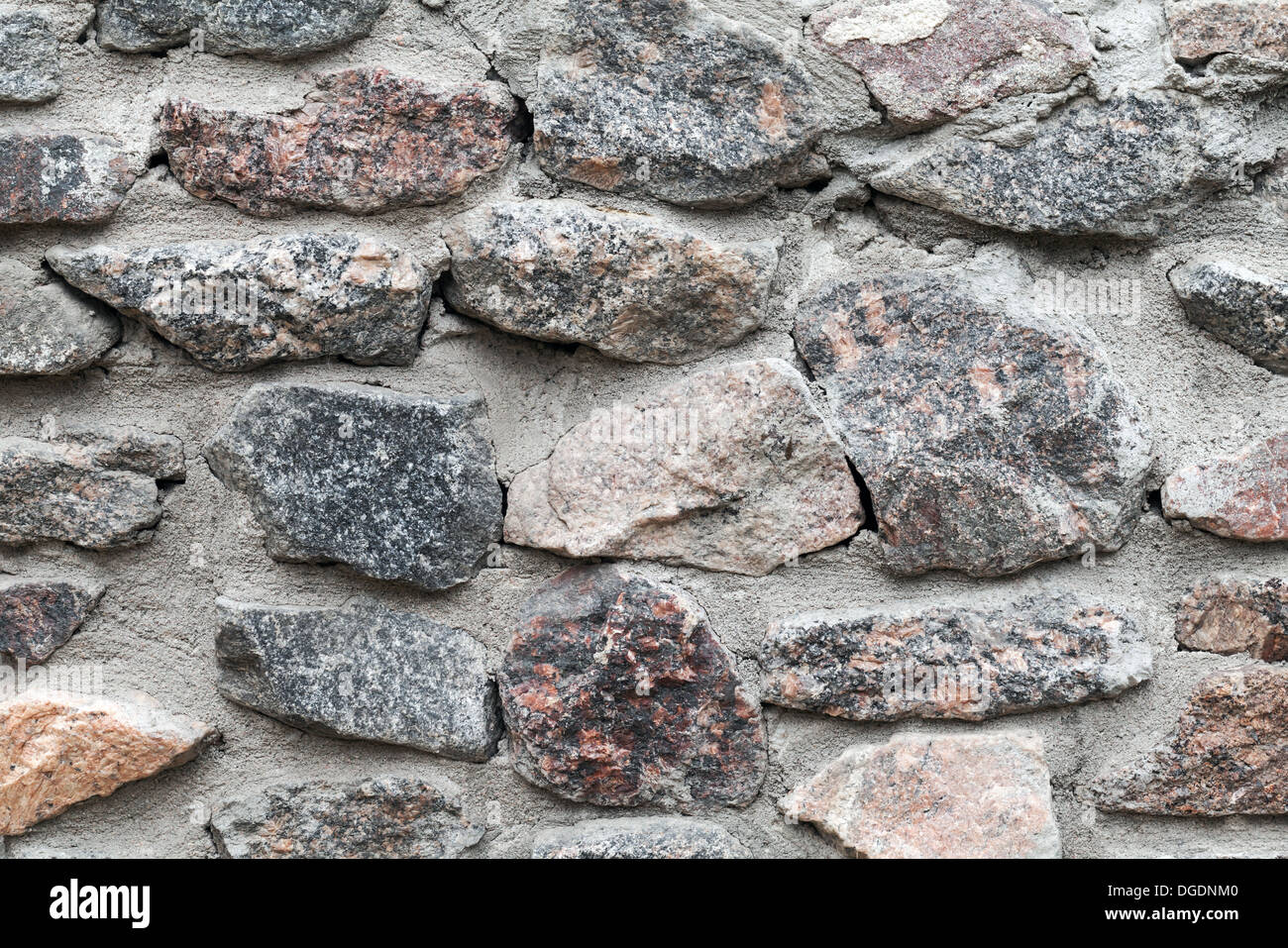 Gris viejo muro de piedra rugosa textura fotográfica de fondo Foto de stock
