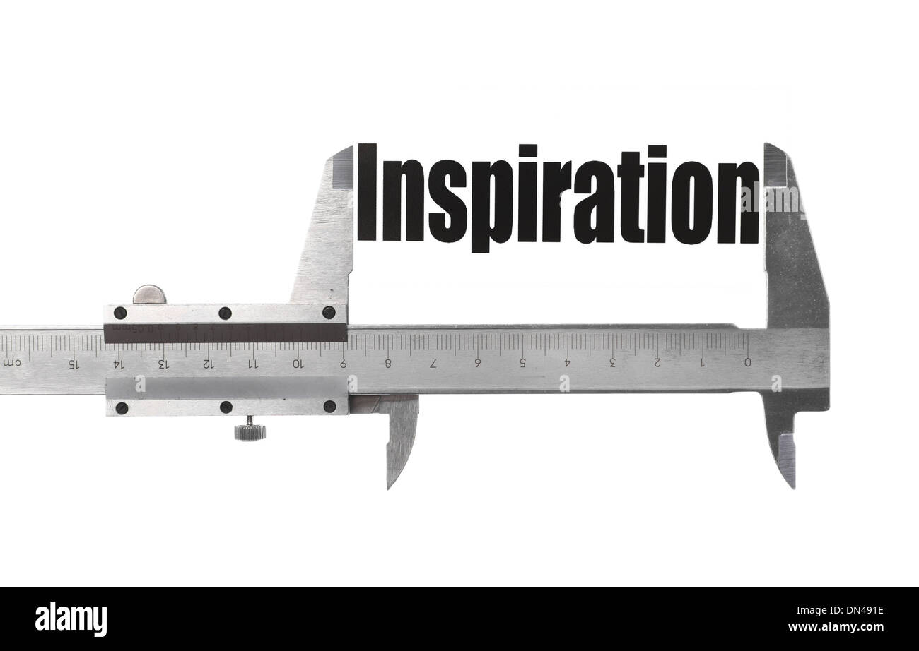 Detalle de un calibre midiendo la palabra "inspiración". Foto de stock