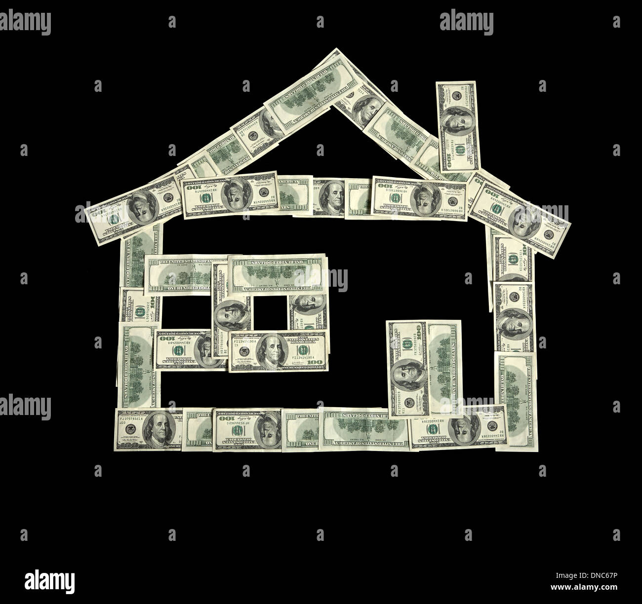 Dinero en forma de una casa Foto de stock