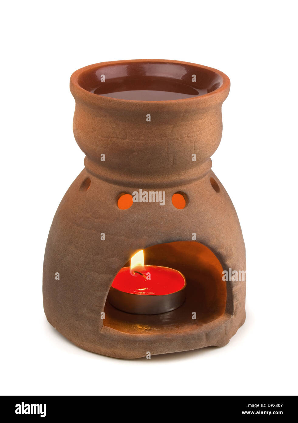 Lámpara de aromaterapia con velas encendidas aislado en blanco Foto de stock