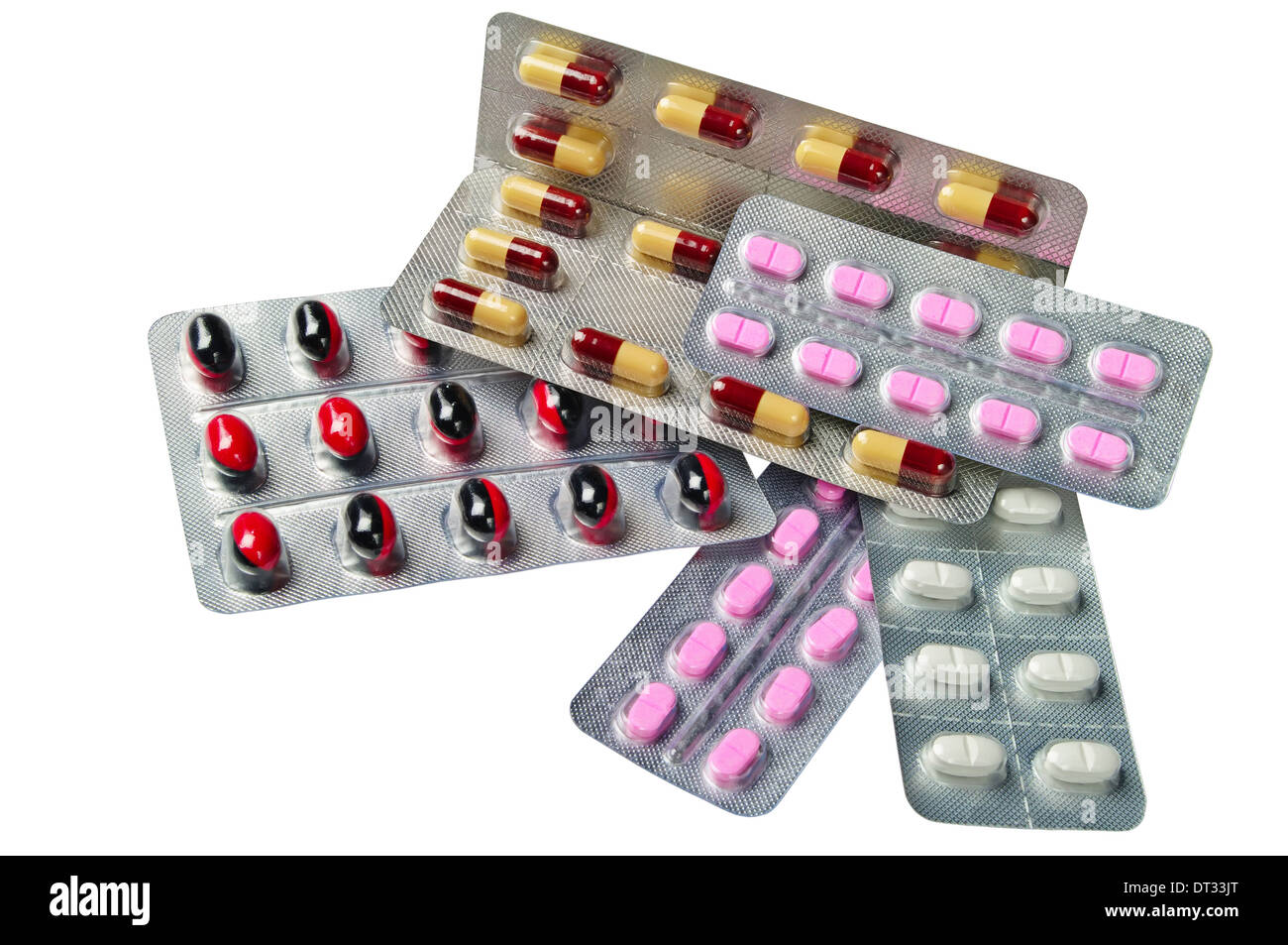 Diferentes medicamentos en tabletas y cápsulas aislado sobre un fondo blanco. Foto de stock