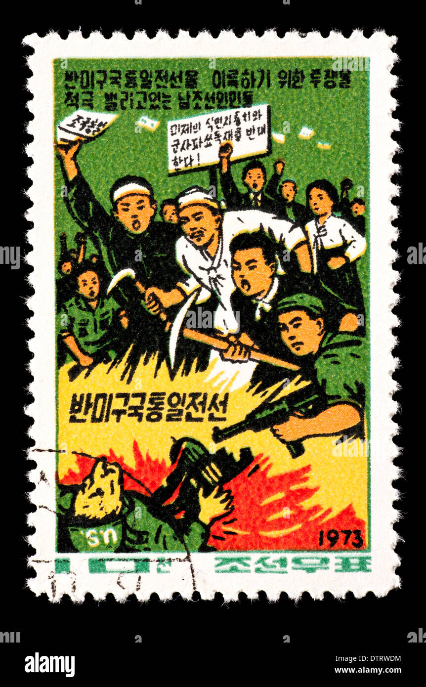 Sello de Corea del Norte que representan hombres y los esfuerzos en pro de la reunificación de la península coreana. Foto de stock