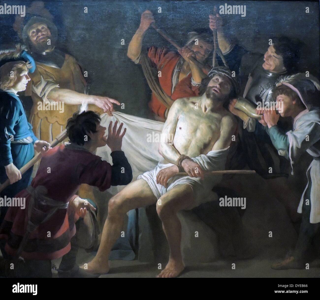 Cristo coronado de espinas por Gerard van Honthorst (1592-1656) óleo sobre lienzo, c 1622. Antes del juicio de Cristo, los soldados romanos colocaron una trenzada corona de espinas en la cabeza, viste con un manto y se burlaban de él. Después de todo, él no fue el "Rey de los judíos'? La escena es dramáticamente iluminado por una antorcha, celebrada por el muchacho de la izquierda. Honthorst probablemente hizo esta pintura para una iglesia católica clandestina (schullkerk) en Ámsterdam. Foto de stock