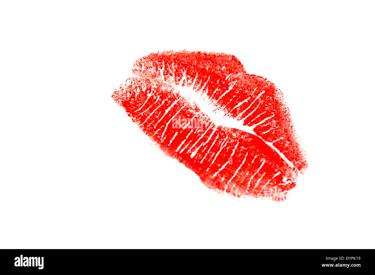 Lápiz labial rojo beso sobre un fondo blanco. Foto de stock