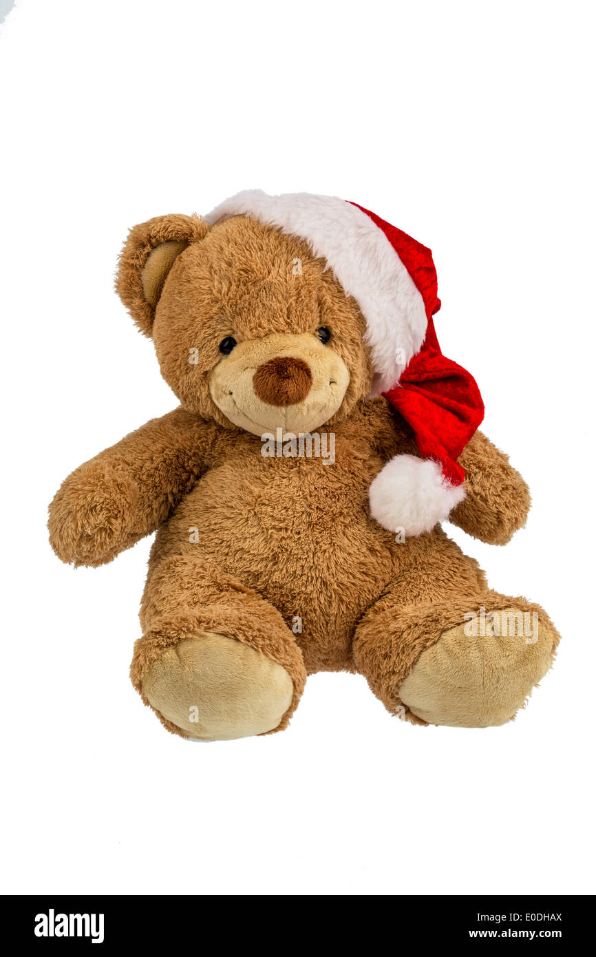 Un oso de peluche con regalos en Navidad. Cuando Santa Claus se viste de fiesta., Ein Teddybaer mit Geschenken zu Weihnachten. Weihnach als Foto de stock