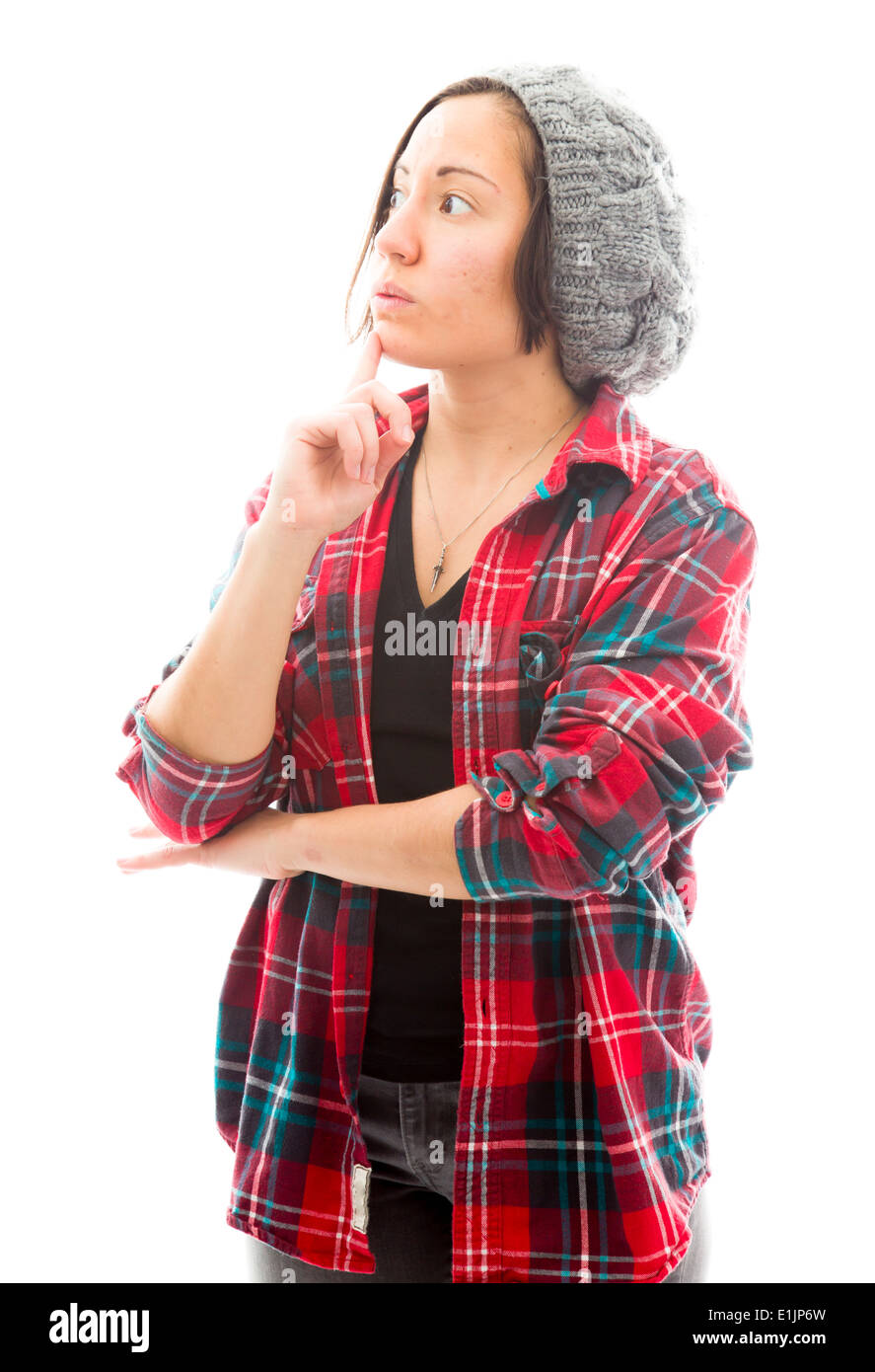 Mujer joven pensando con la mano en la barbilla Foto de stock