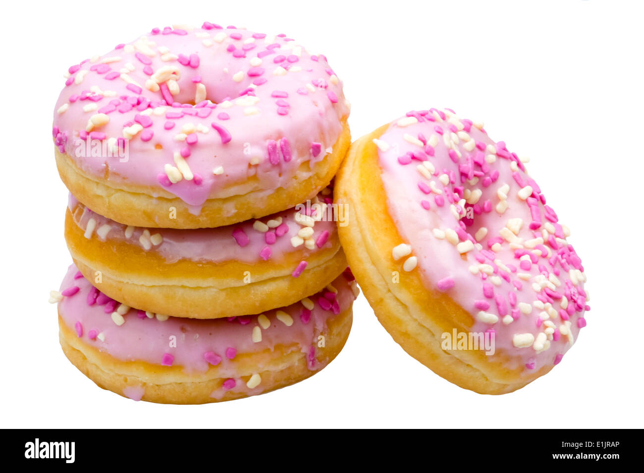 Ring donas con lloviznas y glaseado rosa. Donuts glaseado con glaseado de fresa. Foto de stock