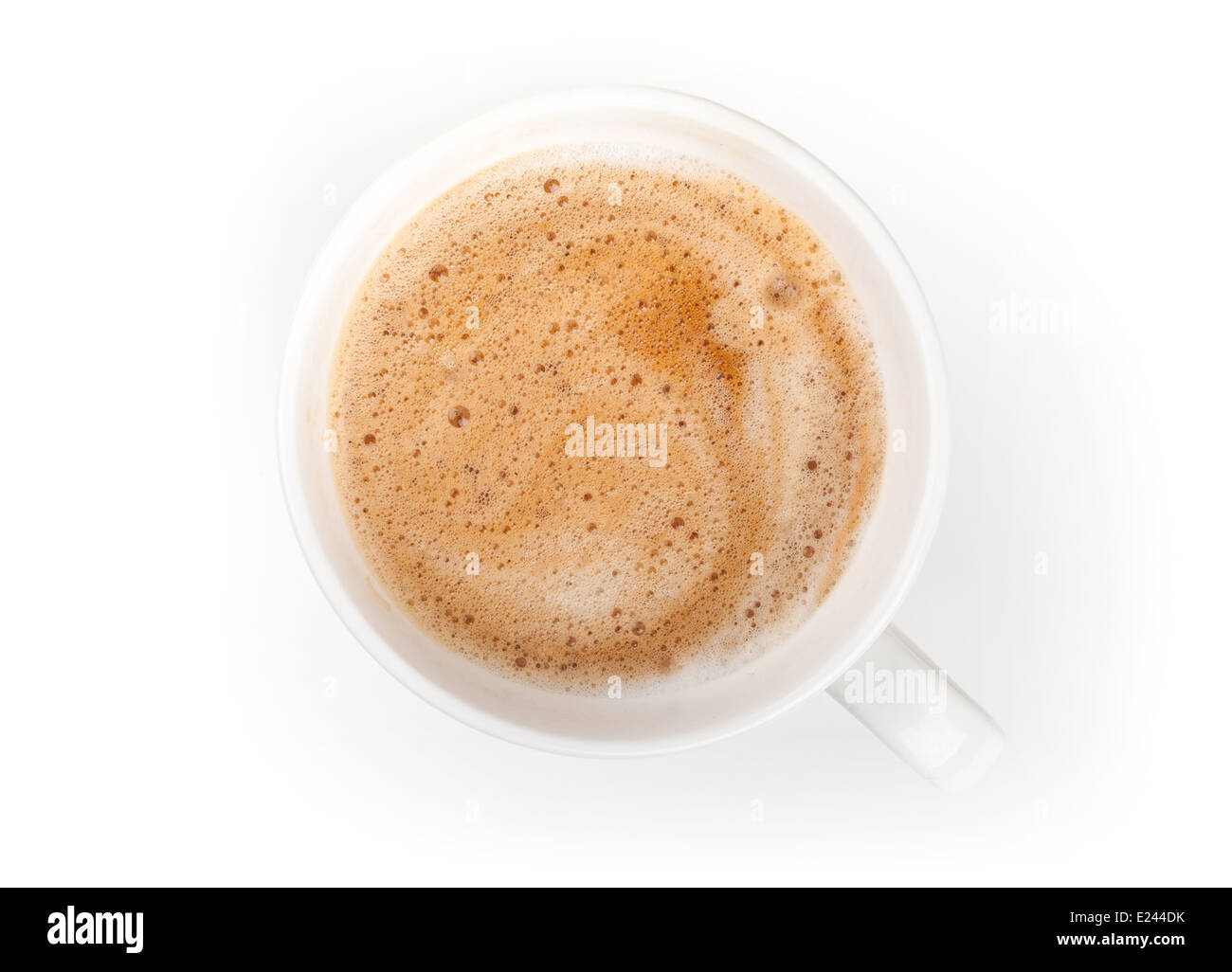 Pequeña taza de café espresso. Vista superior en fondo blanco de mesa Foto de stock