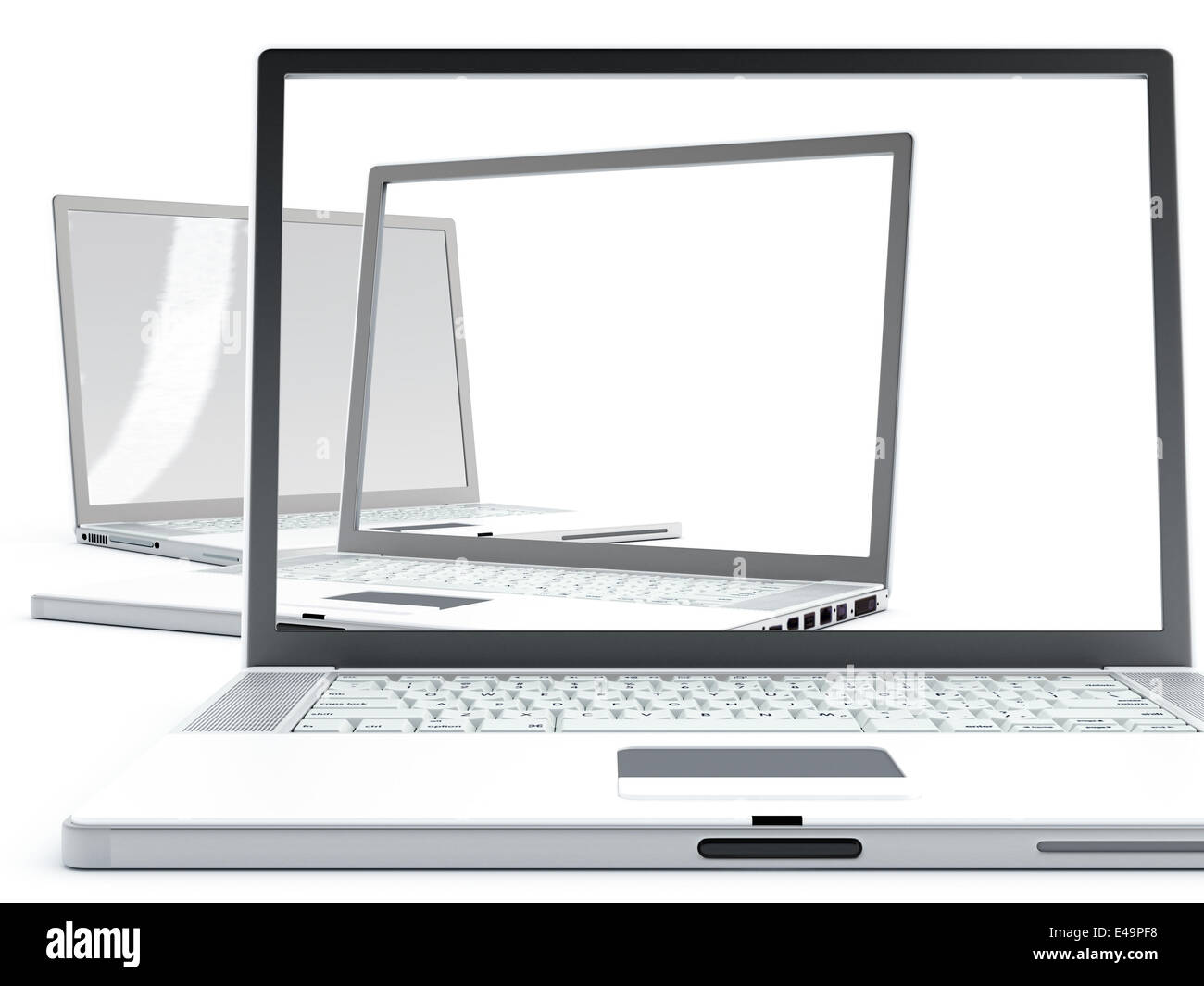 Los ordenadores portátiles modernos con pantallas transparentes Foto de stock