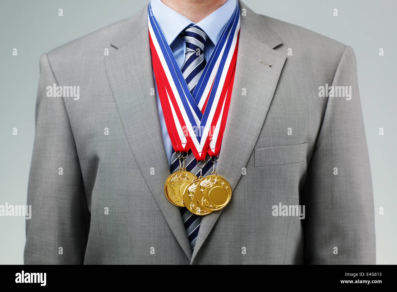 Empresario exitoso con medallas de oro Foto de stock