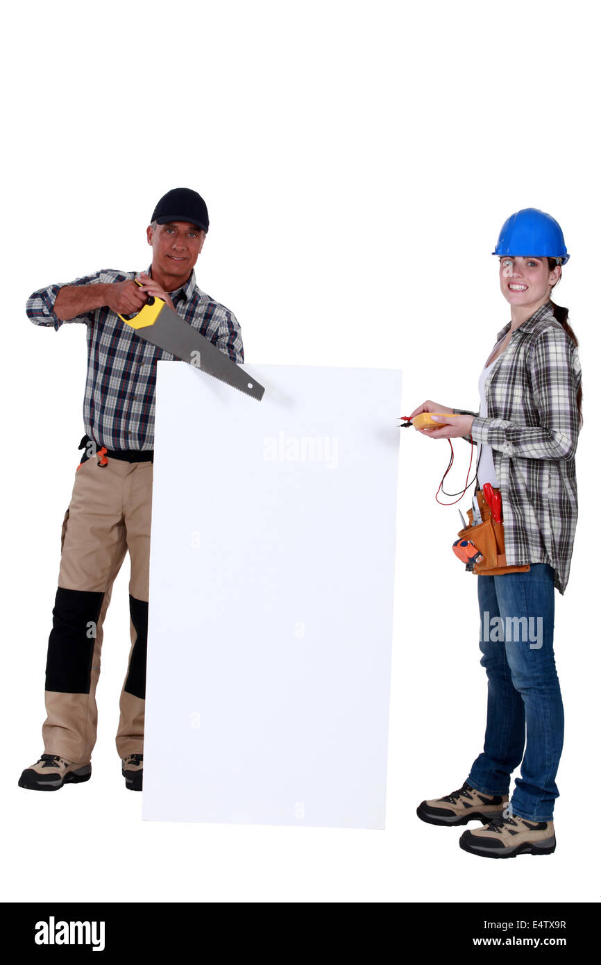 Carpintero, electricista y con una placa en blanco Foto de stock