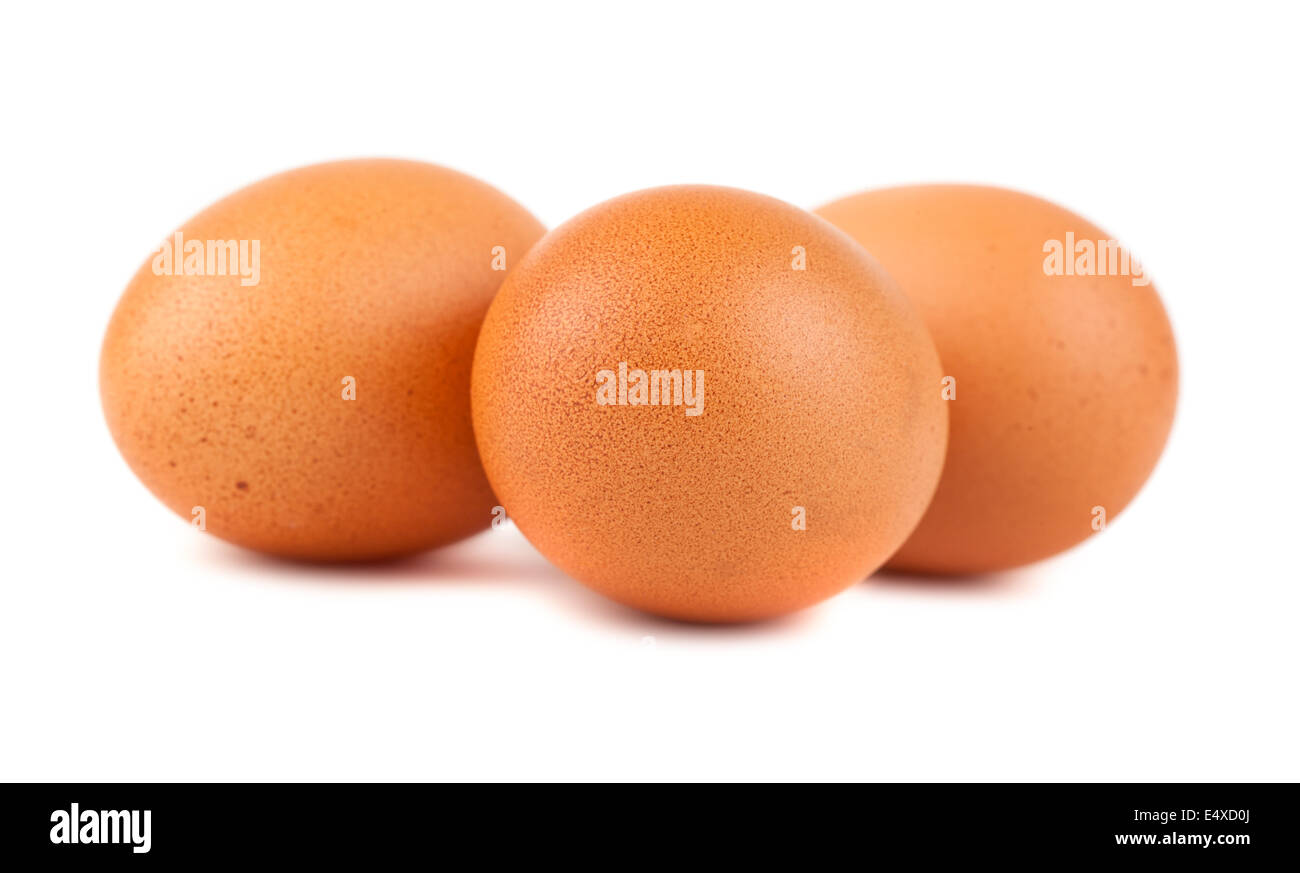 Tres huevos de gallina marrón Foto de stock