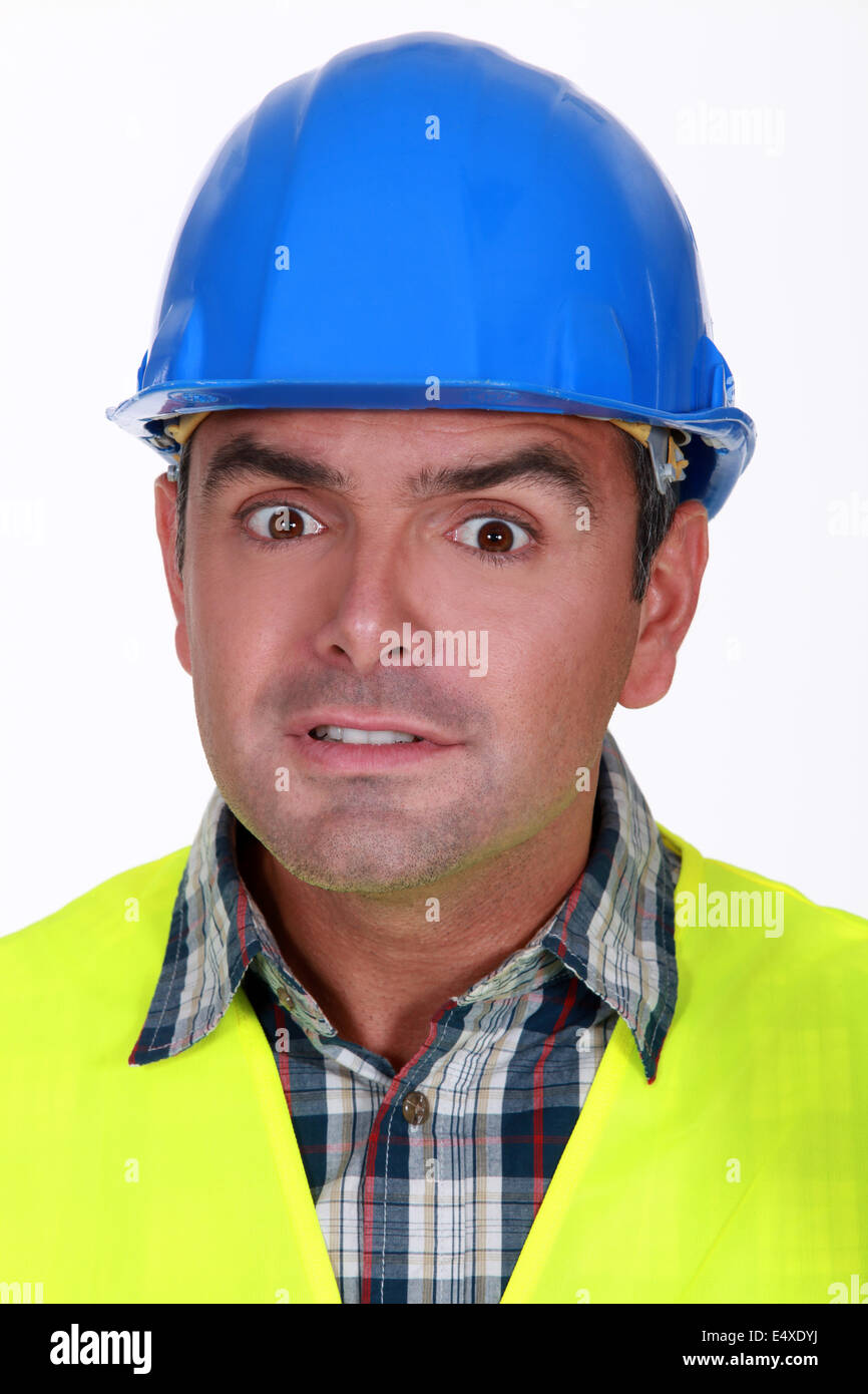 Retrato de horrorizado builder Foto de stock