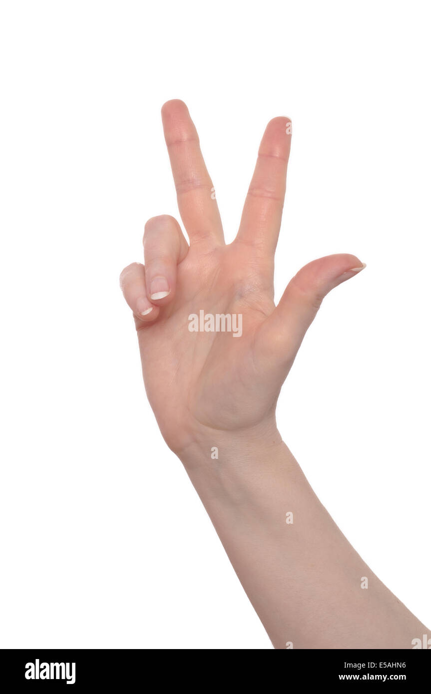 La mano de una mujer con tres dedos hacia arriba Foto de stock