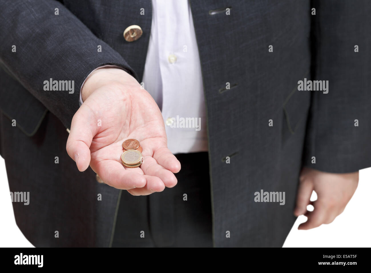Monedas en mano empresario aislado sobre fondo blanco. Foto de stock