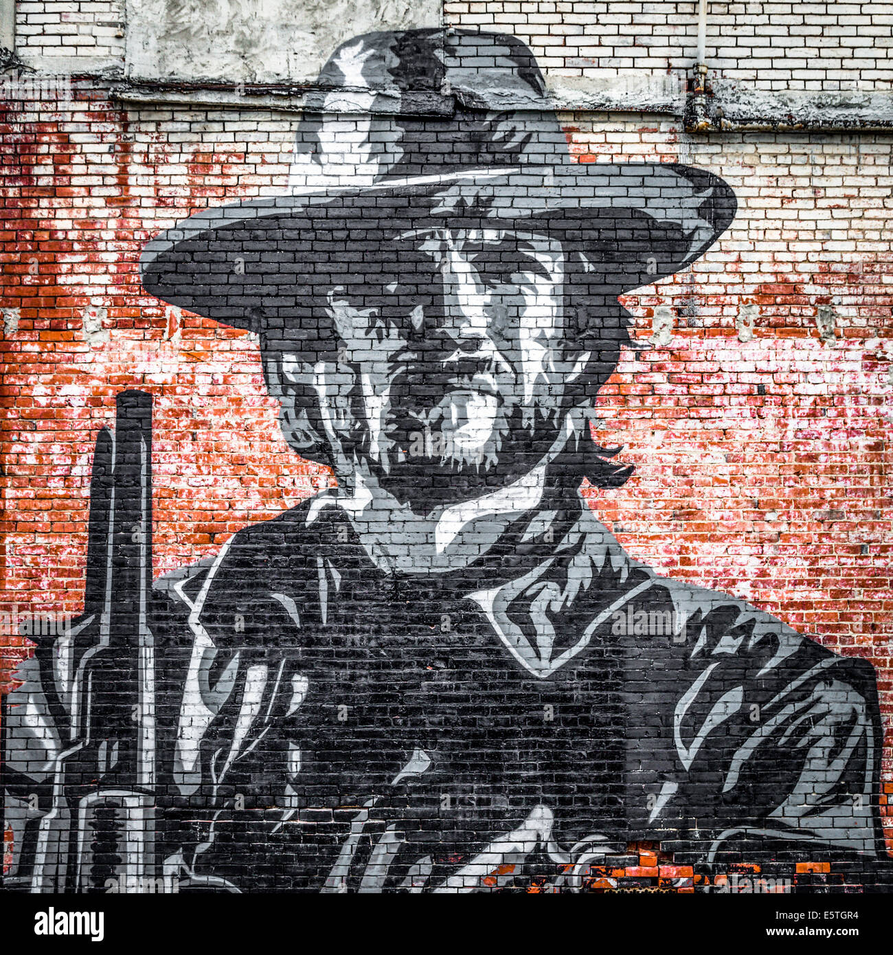 Arte en la calle, mural de un vaquero en una pared de ladrillo, Clarksdale, Mississippi, Estados Unidos Foto de stock
