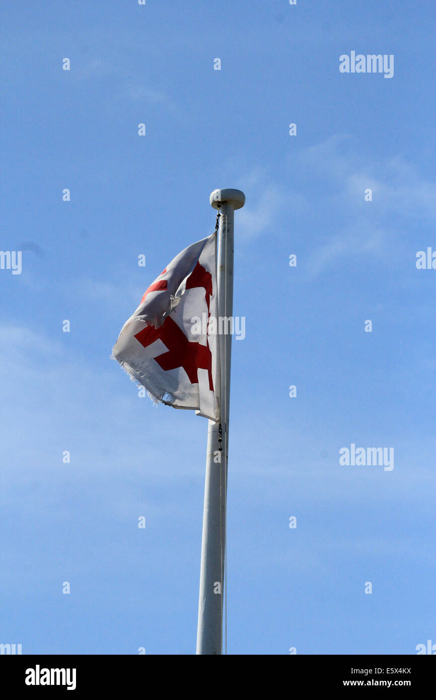 English Heritage bandera ondeando en el viento Foto de stock