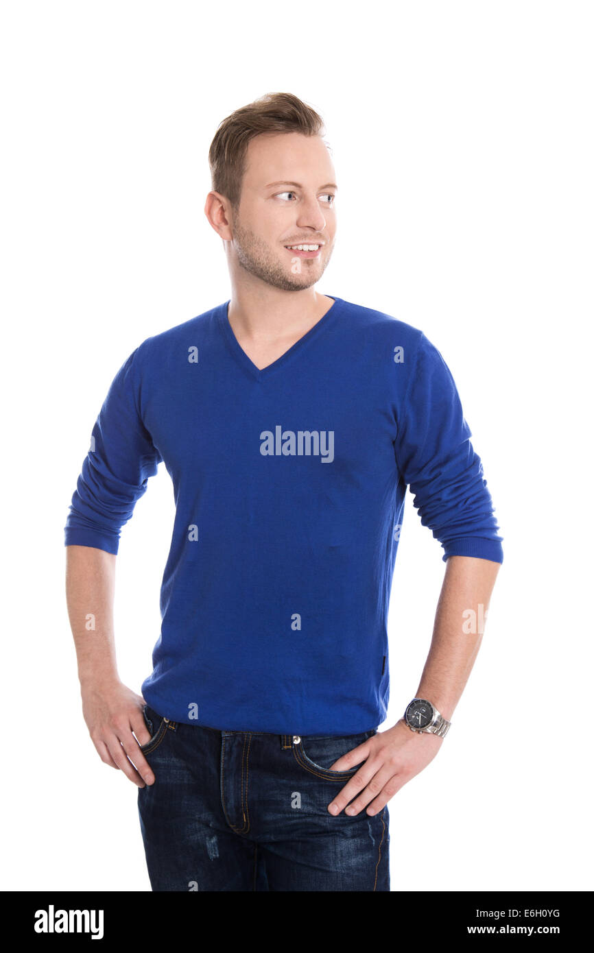 Aislados atractivo joven rubio en azul, suéter mirando lateralmente al texto. Foto de stock