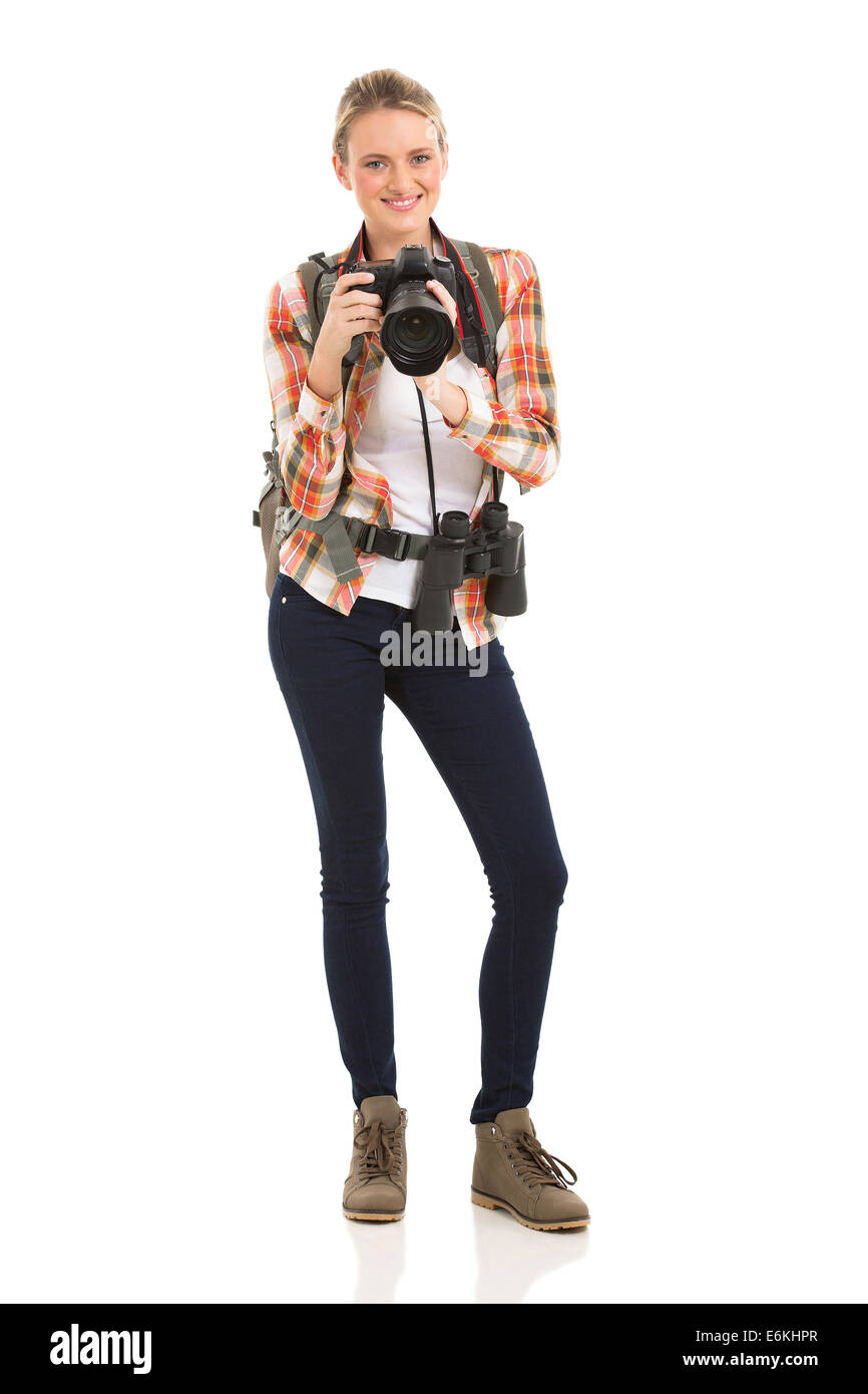 Excursionista de mujer hermosa celebración cámara digital aislado en blanco Foto de stock