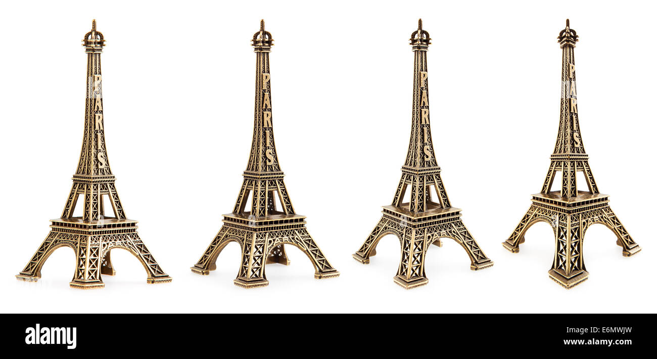 Vista de cerca de una pequeña torre Eiffel estatua fotografiada con diferentes perspectivas sobre fondo blanco. Foto de stock