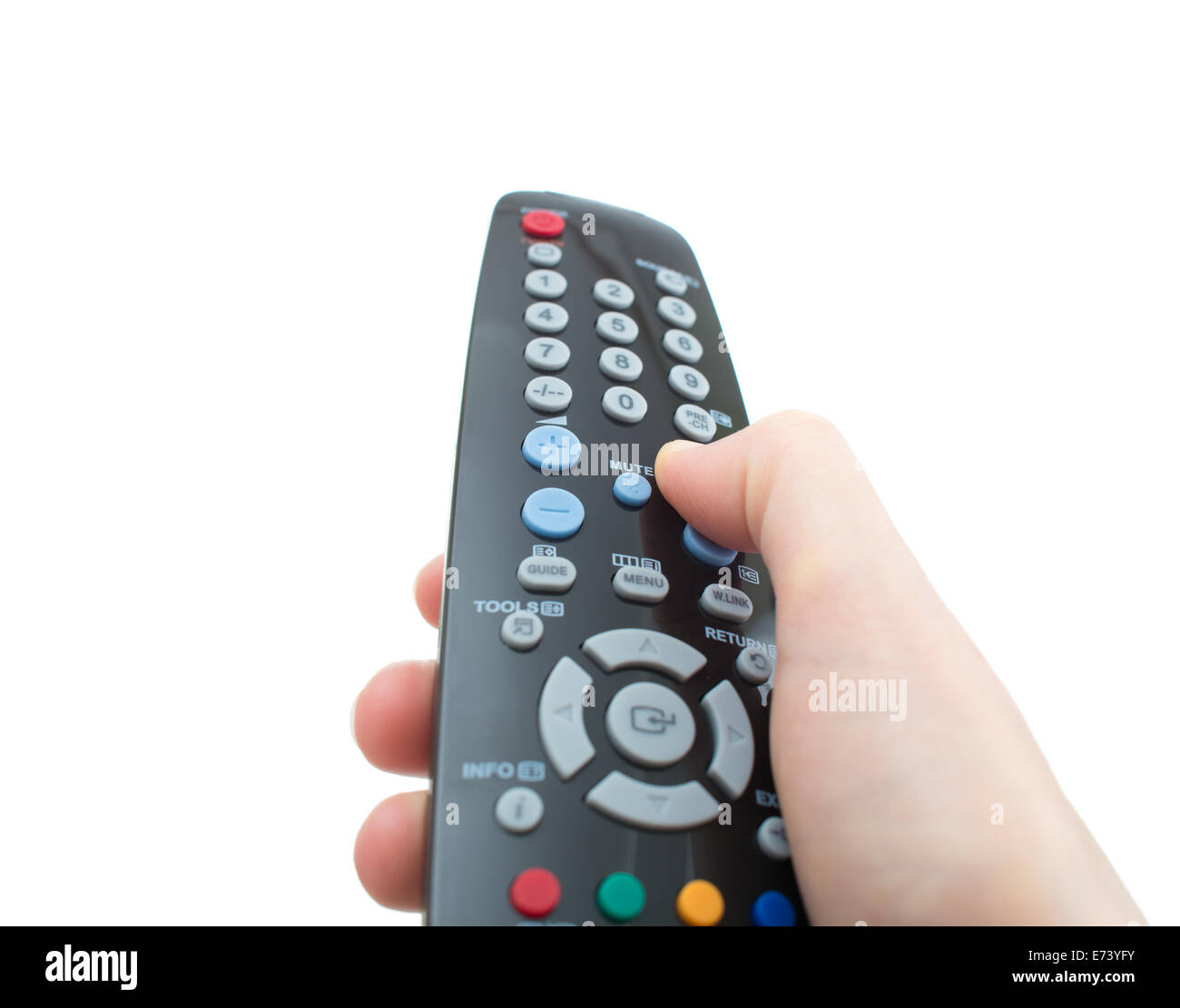 Control remoto del televisor en la mano aislado en blanco Foto de stock