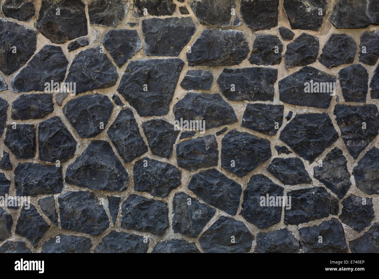 Fondo de pared de piedra oscura Foto de stock