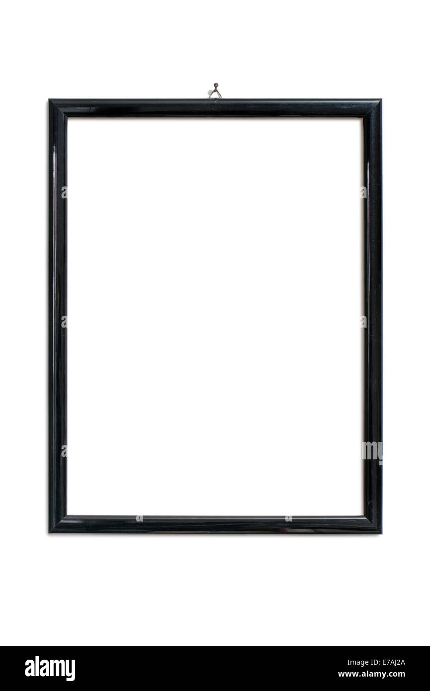Picture frame negro colgando de uña, aislado en blanco Foto de stock