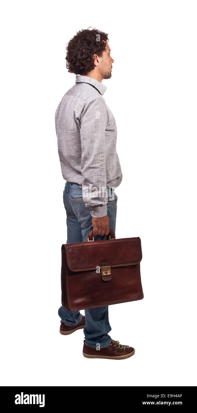 Hombre de pie con bolsa aislado en blanco Foto de stock