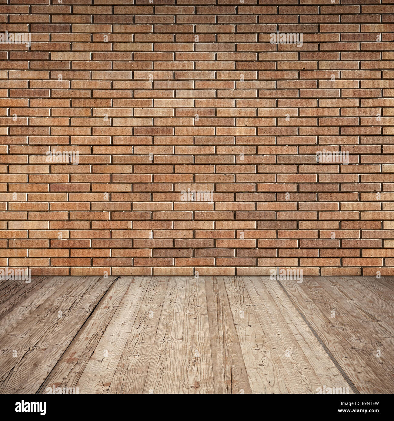 Pared de ladrillo rojo y piso de madera, detalle de textura de fondo interior vacío Foto de stock