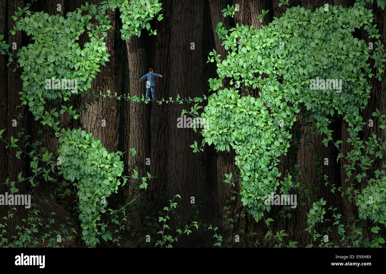 Concepto de negocio de riesgo global de crecimiento como empresario caminando sobre una cuerda floja de plantar vides en un fondo de bosque de las hojas de los árboles en forma de vid como un mapa del mundo como una metáfora para el comercio internacional y la inversión la incertidumbre o la conservación del medio ambiente es Foto de stock