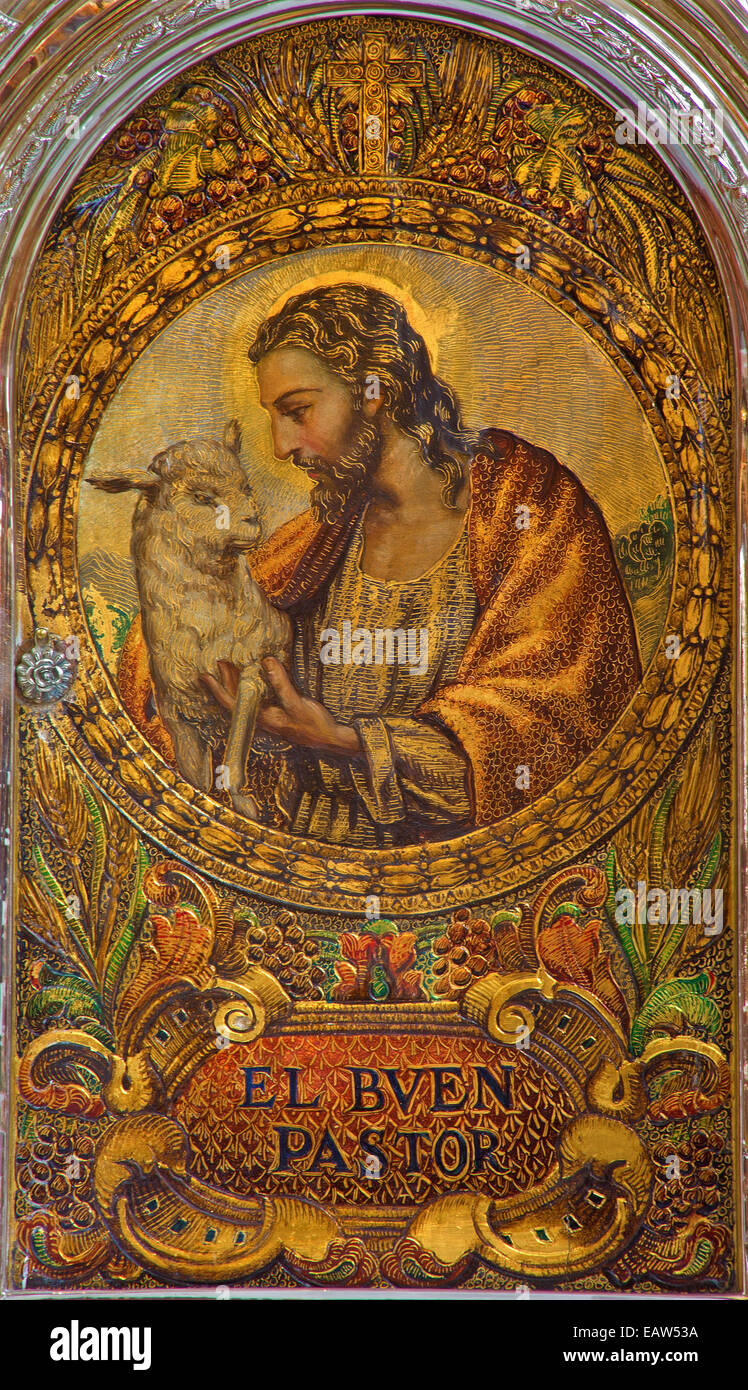 Sevilla - El Jesucristo como Buen Pastor. Pintura en el sagrario en la Iglesia de San Roque del 19.%. Foto de stock
