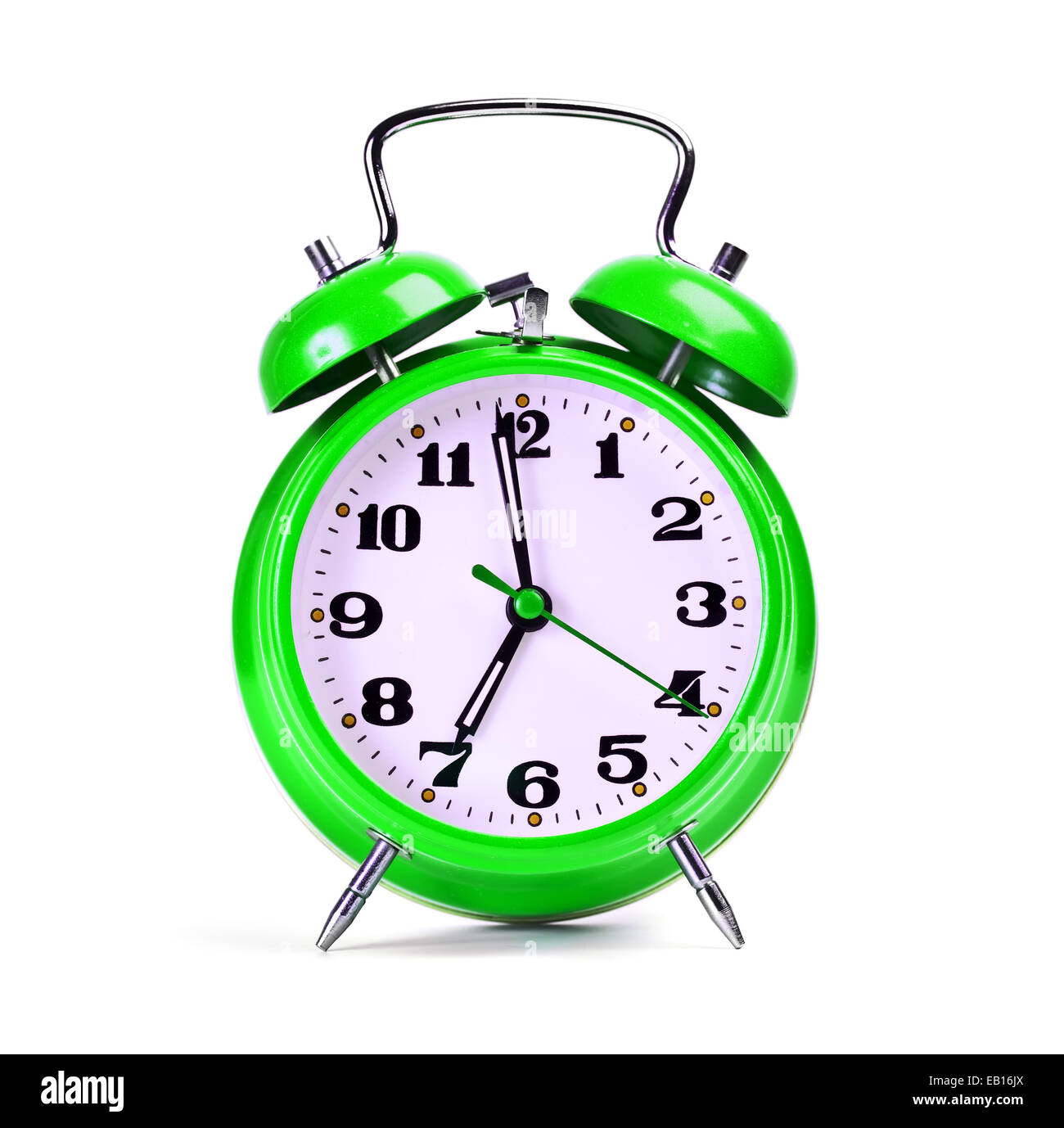 Reloj de alarma verde sobre blanco Foto de stock