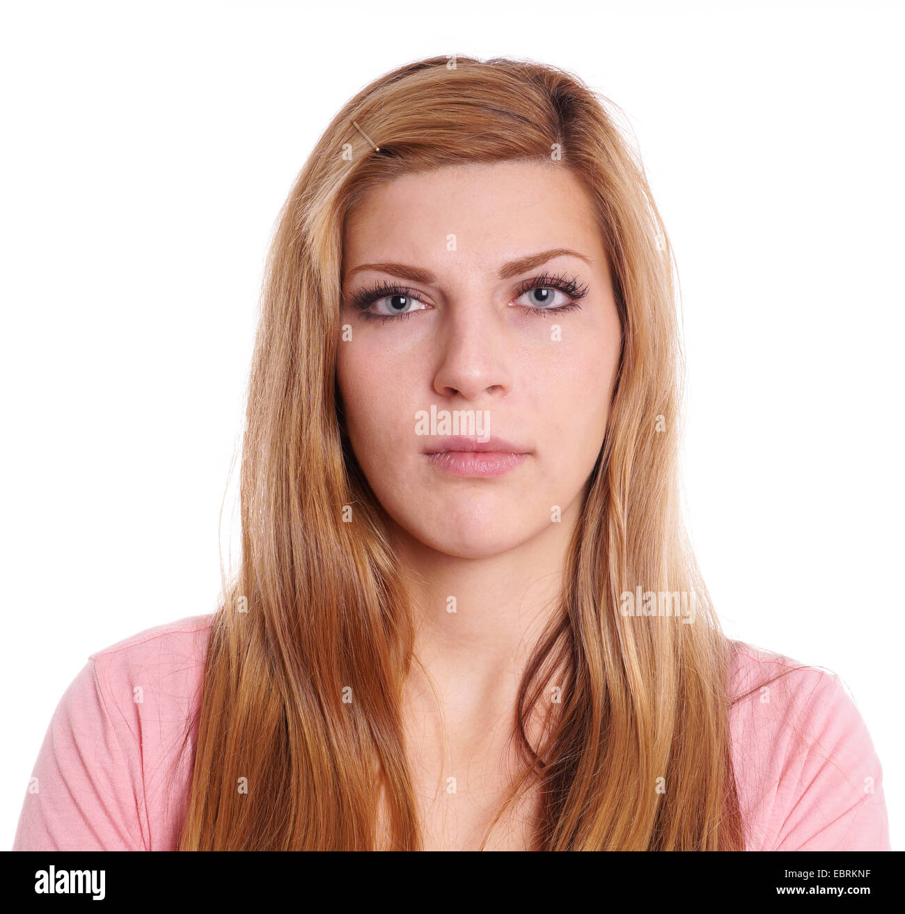 Mujer joven con expresión neutra headshot Foto de stock