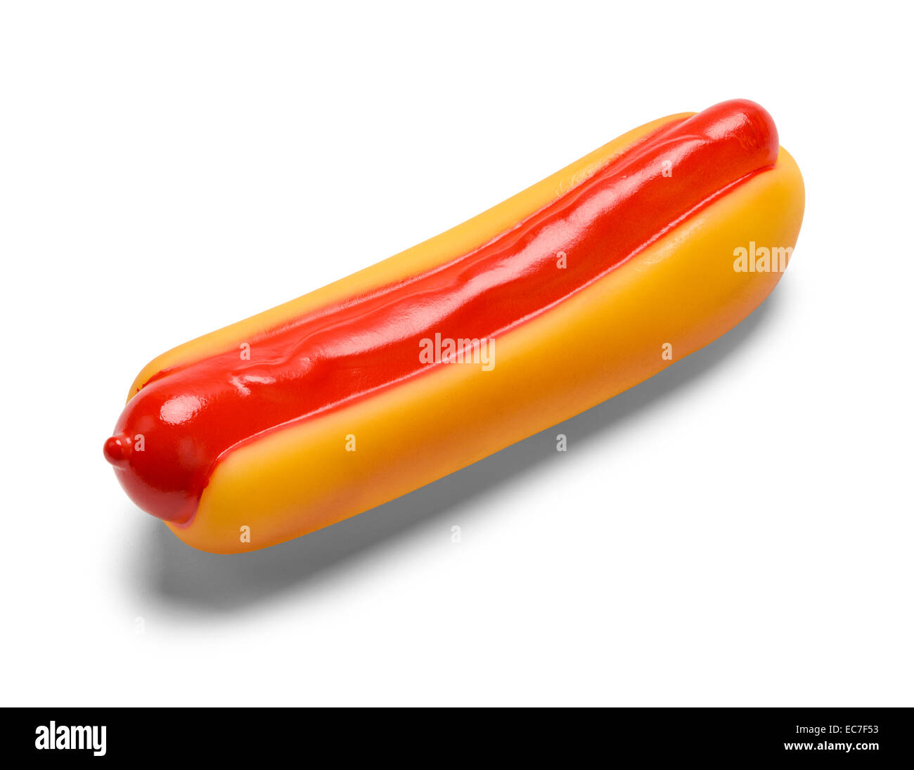 Squeaky Hot Dog plástico PET Toy aislado sobre fondo blanco. Foto de stock