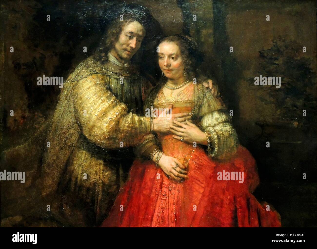 La novia judía es una pintura de Rembrandt, pintada alrededor de 1667. La pintura obtuvo su nombre en los comienzos del siglo XIX, cuando un coleccionista de arte de Amsterdam identificó el tema como el de un padre judío otorgando un collar a su hija el día de su boda. Foto de stock