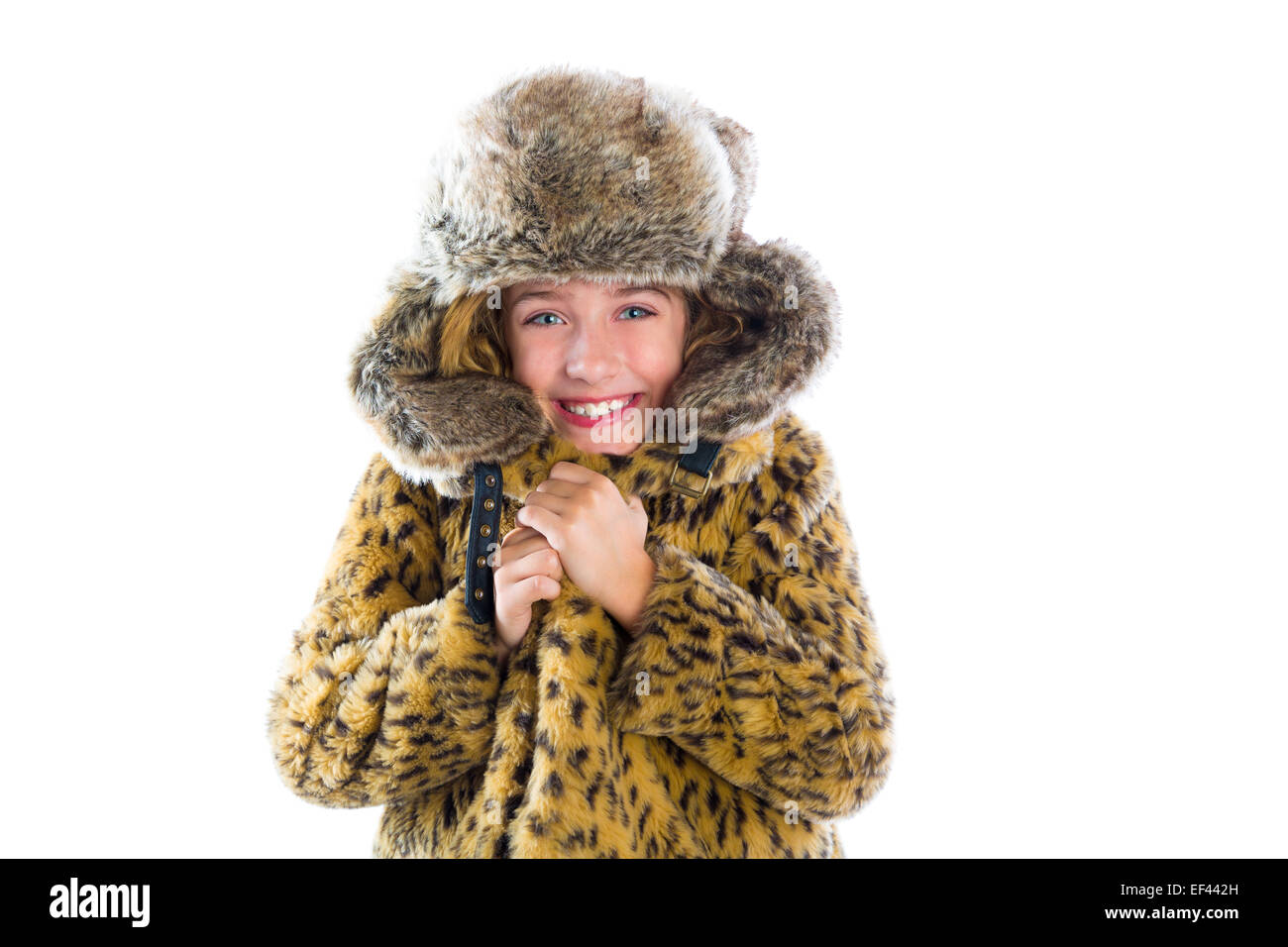 Chico chica rubia de invierno frío gesto de congelación con expresión de moda ropa de pieles y la tapa Foto de stock