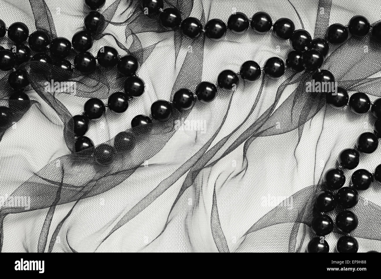 Tul negro con fondo negro cordones Foto de stock