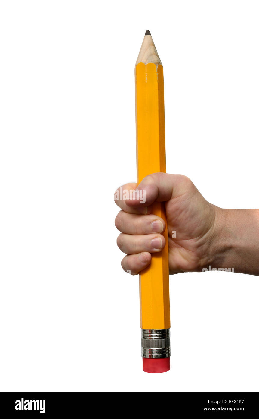 Gran lápiz en mano sobre un fondo blanco. Foto de stock