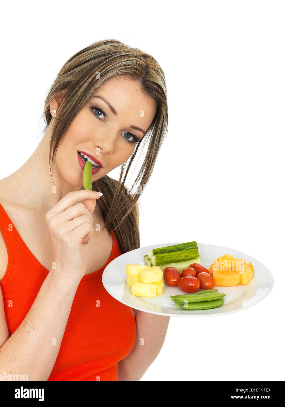 Mujer joven y saludable comer cinco veces al día Foto de stock