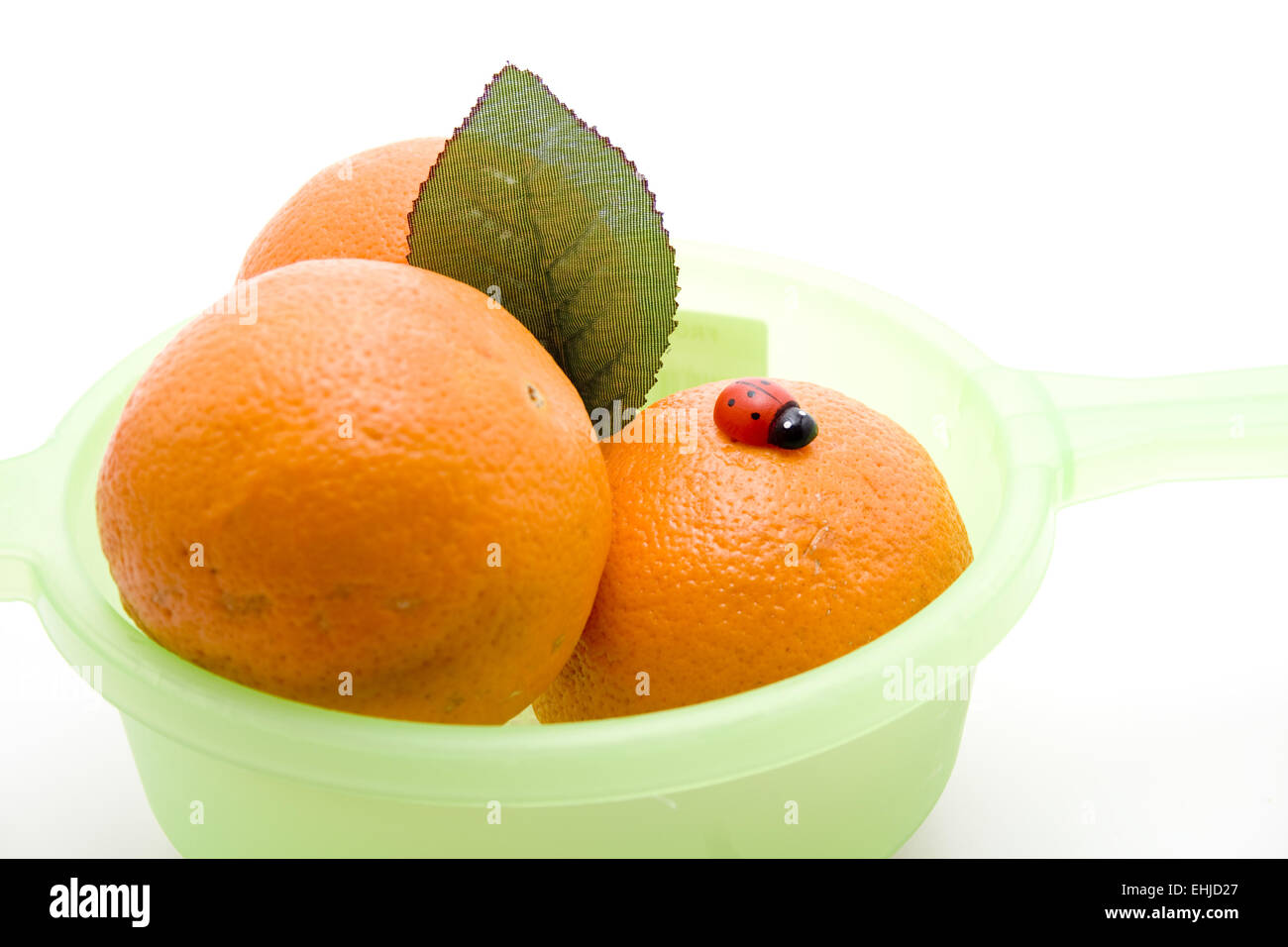 Las naranjas con mariquita Foto de stock