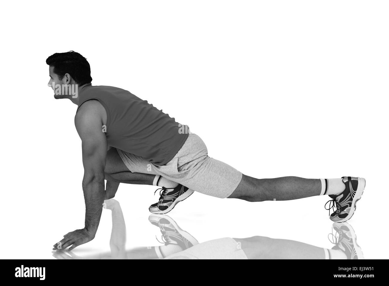Imagen compuesta de vista lateral de un monte hombre haciendo ejercicio de estiramiento Foto de stock