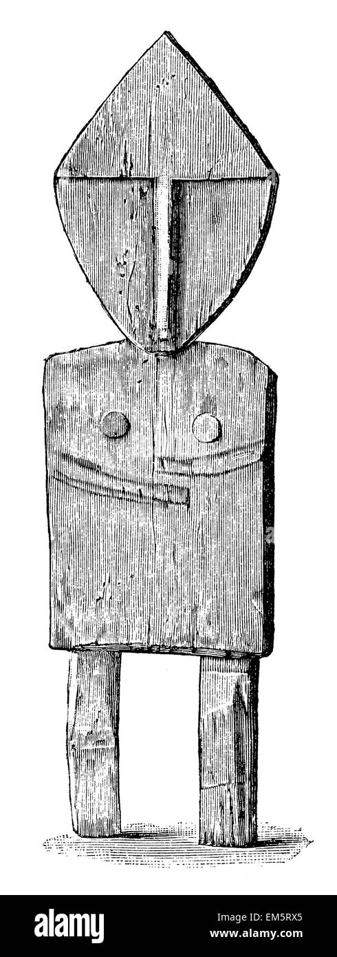 Figura de madera dorada (Siberia), representando el chamán candidato Foto de stock