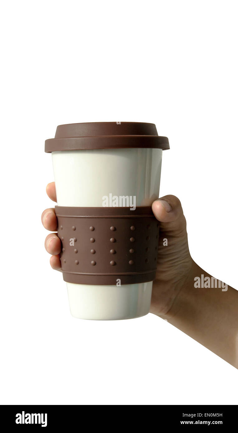 Cerrar la taza de café en la mano en aislar antecedentes Foto de stock